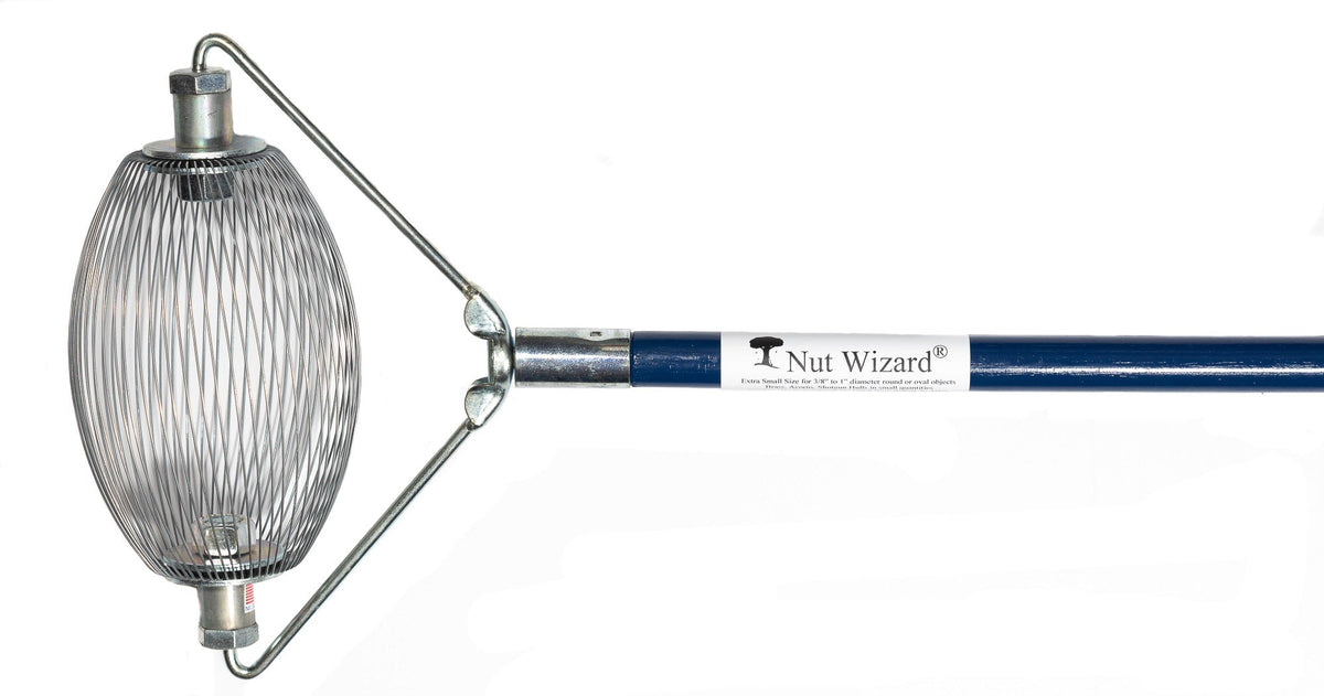 A Small Nut Wizard® with its many wires that are held together with metal plates to create a "basket,"; The plates have two large bolts sticking out on either end. The bolts are attached to a “bail,” a thin metal wire-type part bent in three points with a threaded piece in the center that attaches the Nut Wizard® basket to a blue, four-foot wooden handle. The handle has a white label with a tree and the words "Nut Wizard®" on it.